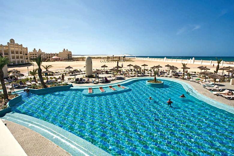 Pool beside the ocean at ClubHotel Riu Karamboa, Cape Verde